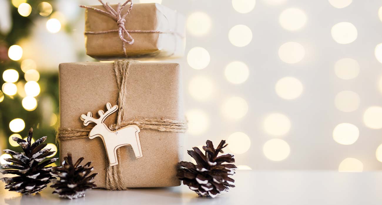 Presents and pine cones on background